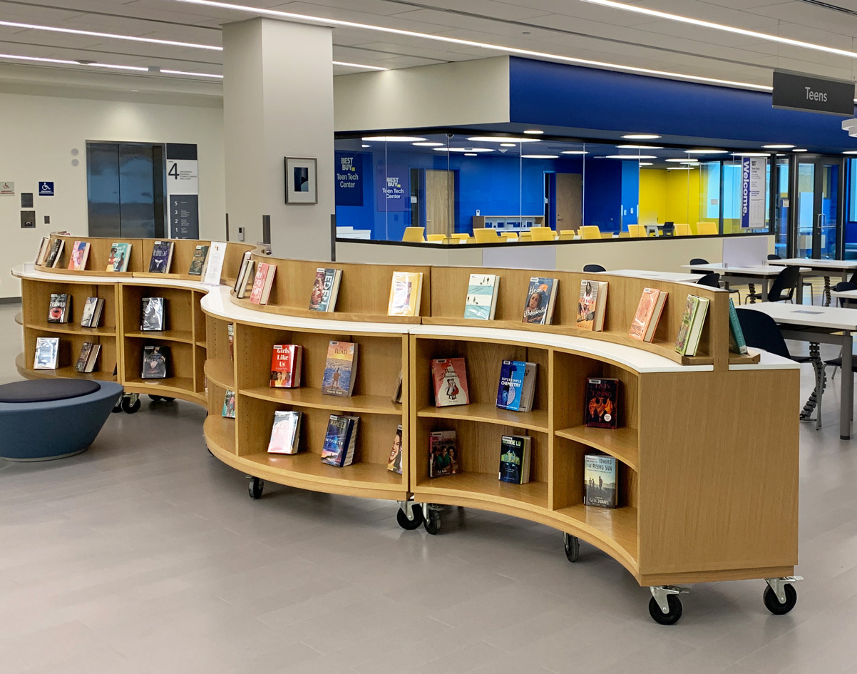 Curved mobile book shelves on casters with book display on top