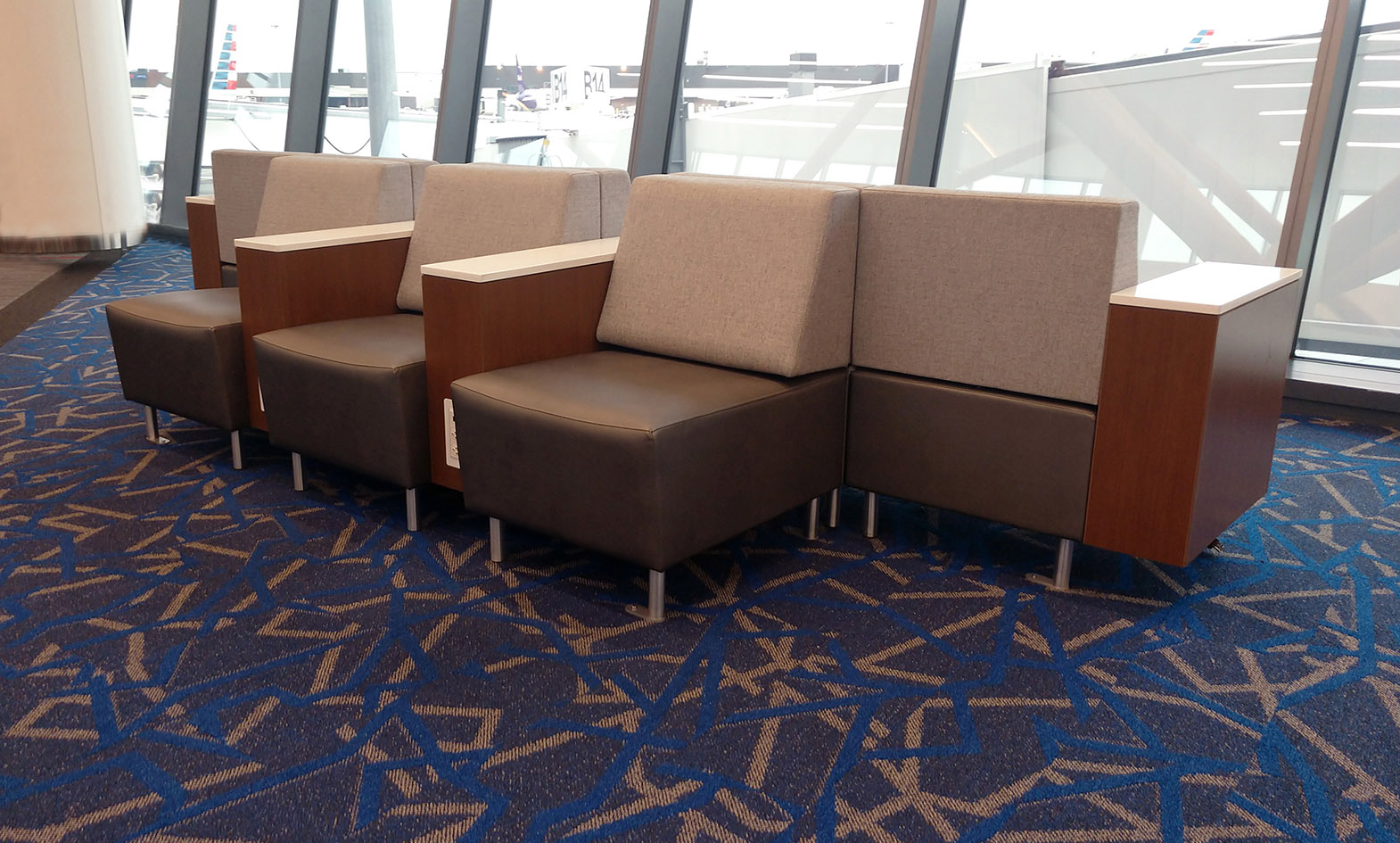 Airport lounge seating with powered occasional tables