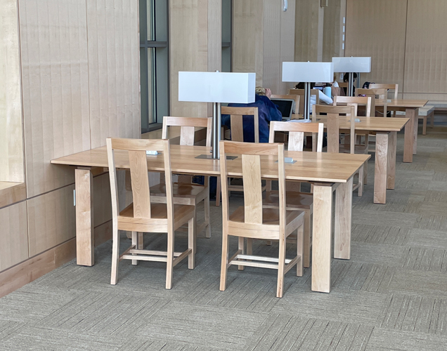 Custom wood library tables with integrated lamp and matching wood pull up chairs