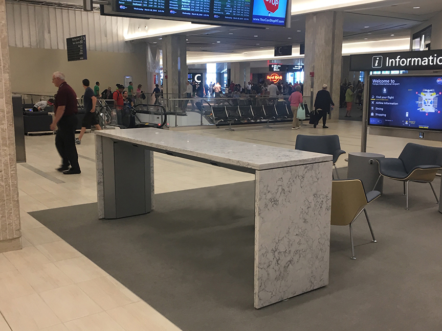 Airport Charging tables with granite surface and panels