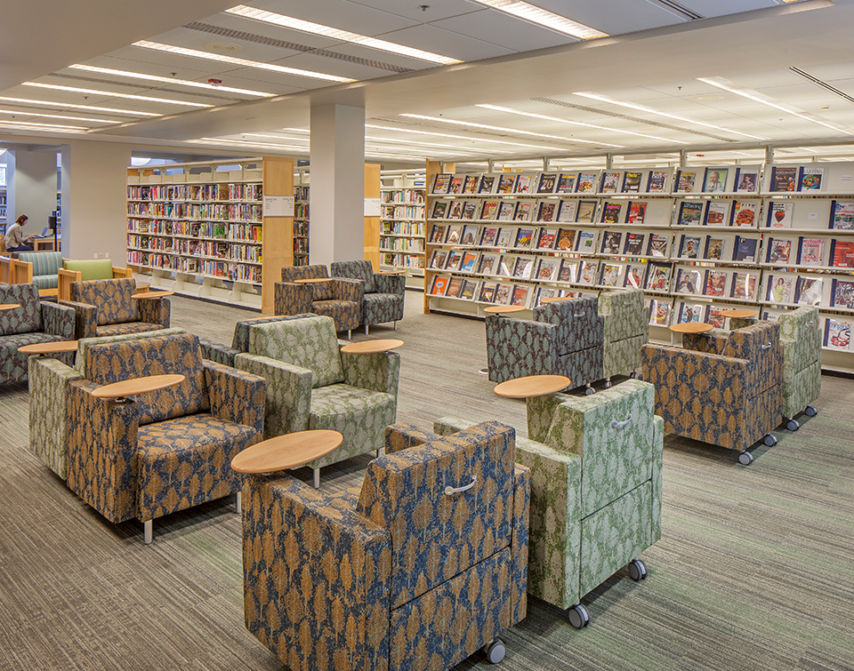 Durable Lounge chairs with back handle and tablet arm in community college library