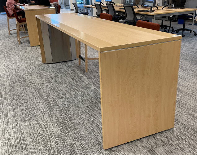 library charging table with metal base and laminate top and side panels