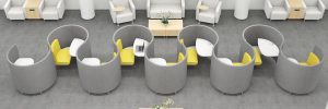 Curved study carrels and lounge chairs with power access in serpentine layout