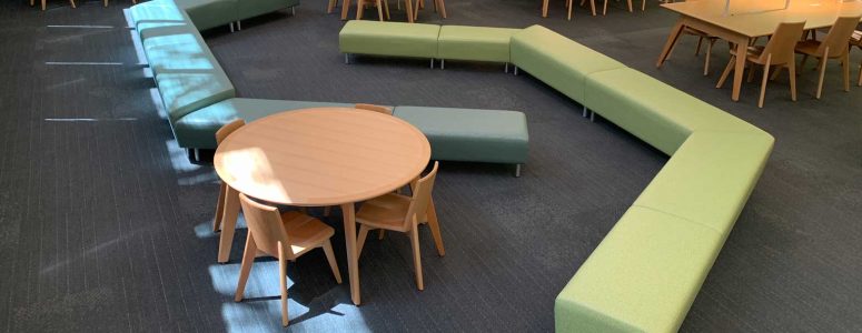 unique benches for public library with wood tables featuring integrated light and matching seating