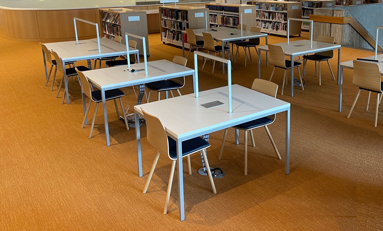 contemporary library tables with integrated light and power access