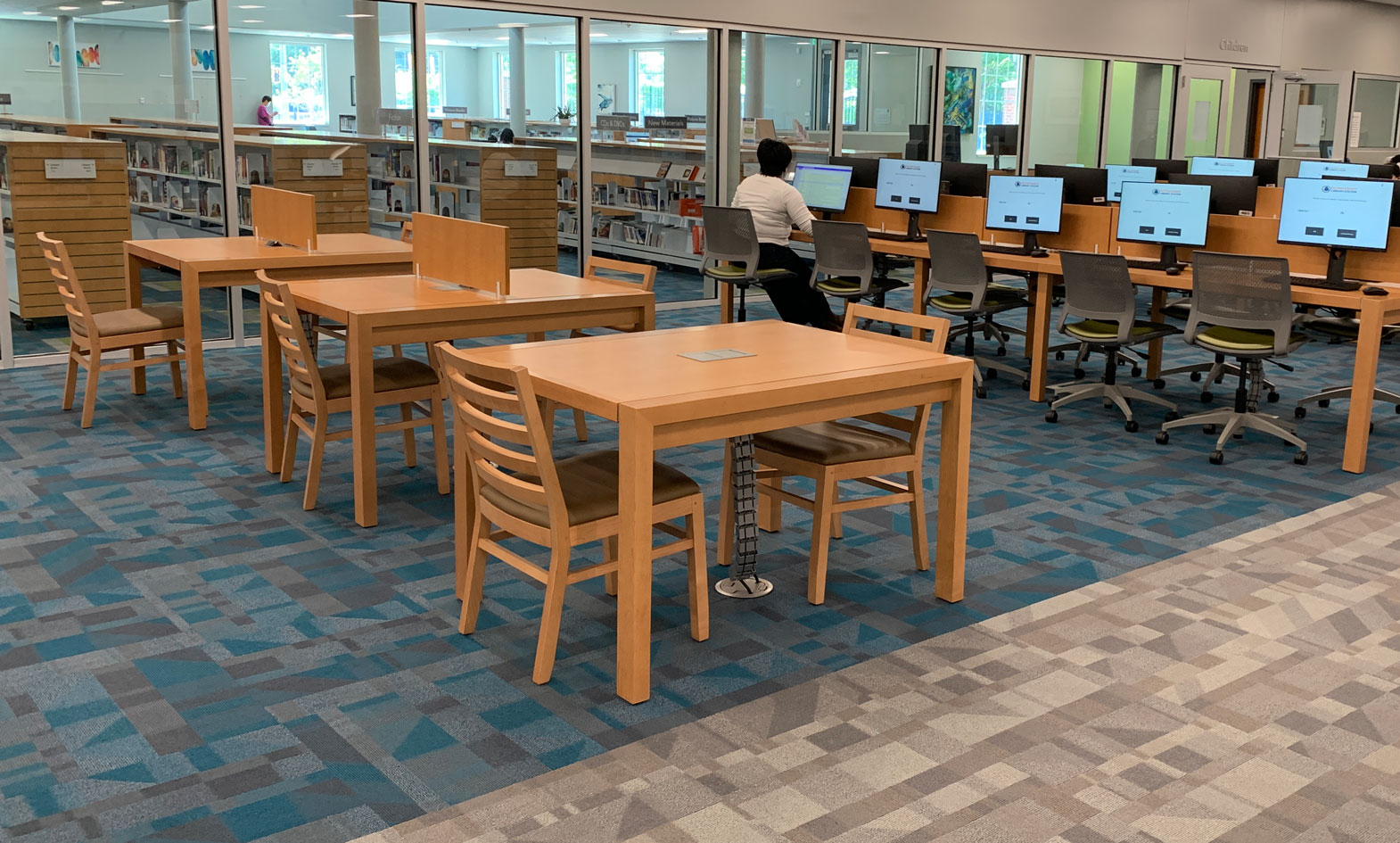 Wood library tables and computer stations with cable management and power access