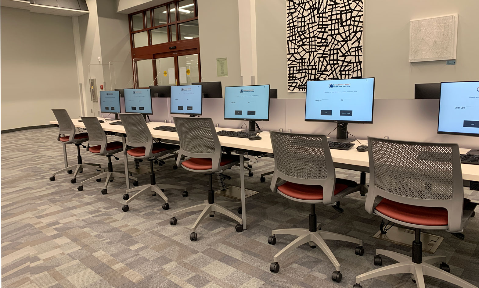 large, two sided library computer table with frosted privacy panel