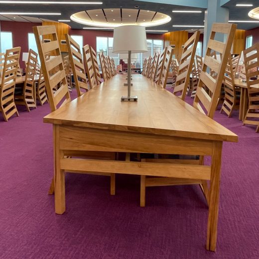 Custom wood library chairs and library tables with lamps in University