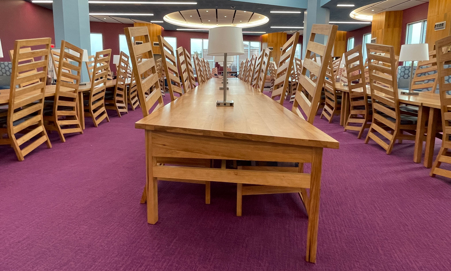 Custom wood library chairs and library tables with lamps in University