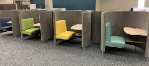 modern study carrel with upholstered curved walls and access to power