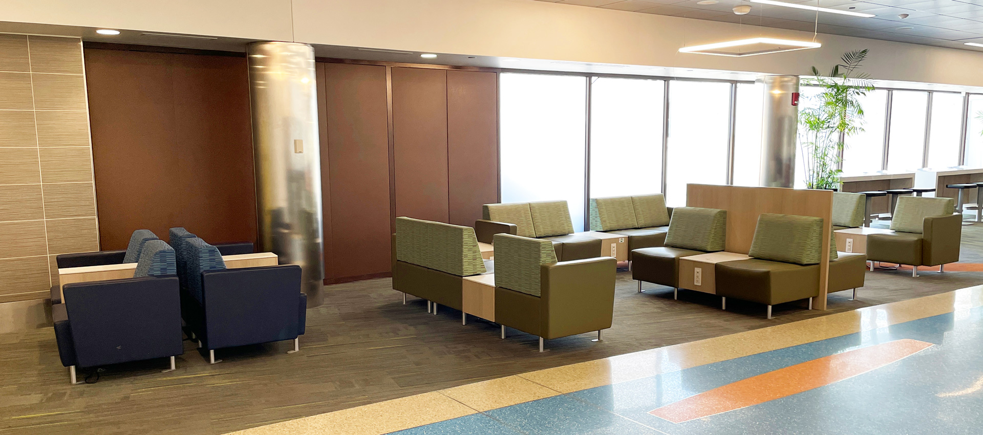 Modular lounge seating configurations with privacy panels in Boston Logan Airport