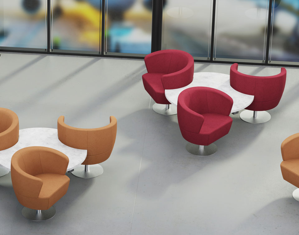 Groupings of three circular lounge chairs around stone tables