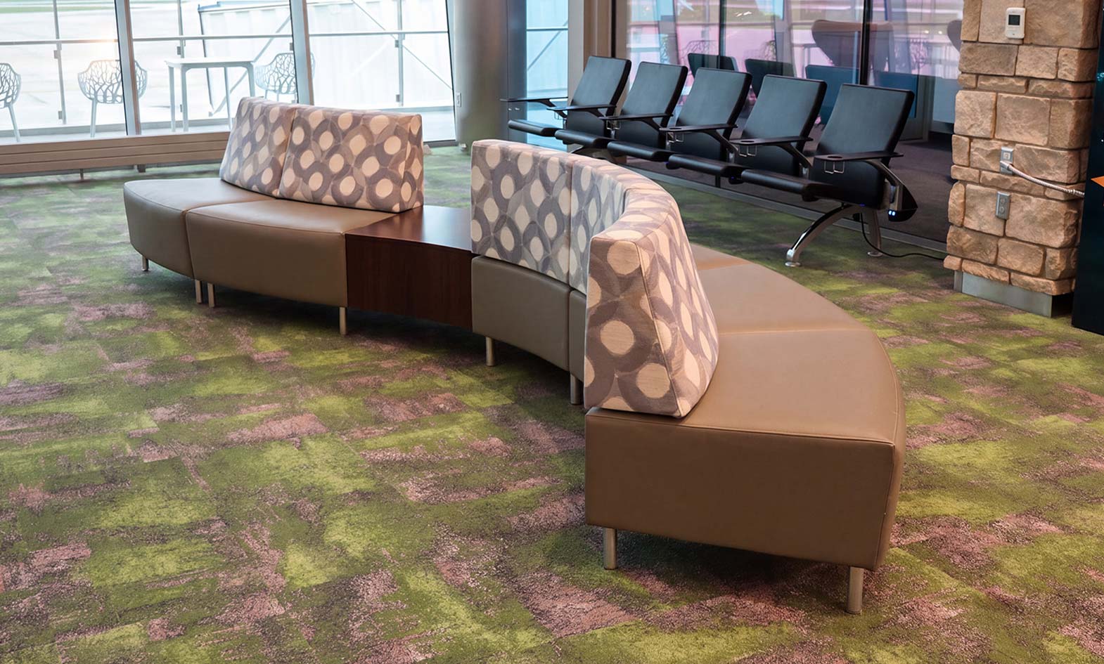 Curved lounge seating by agati furniture at gate in for wayne airport