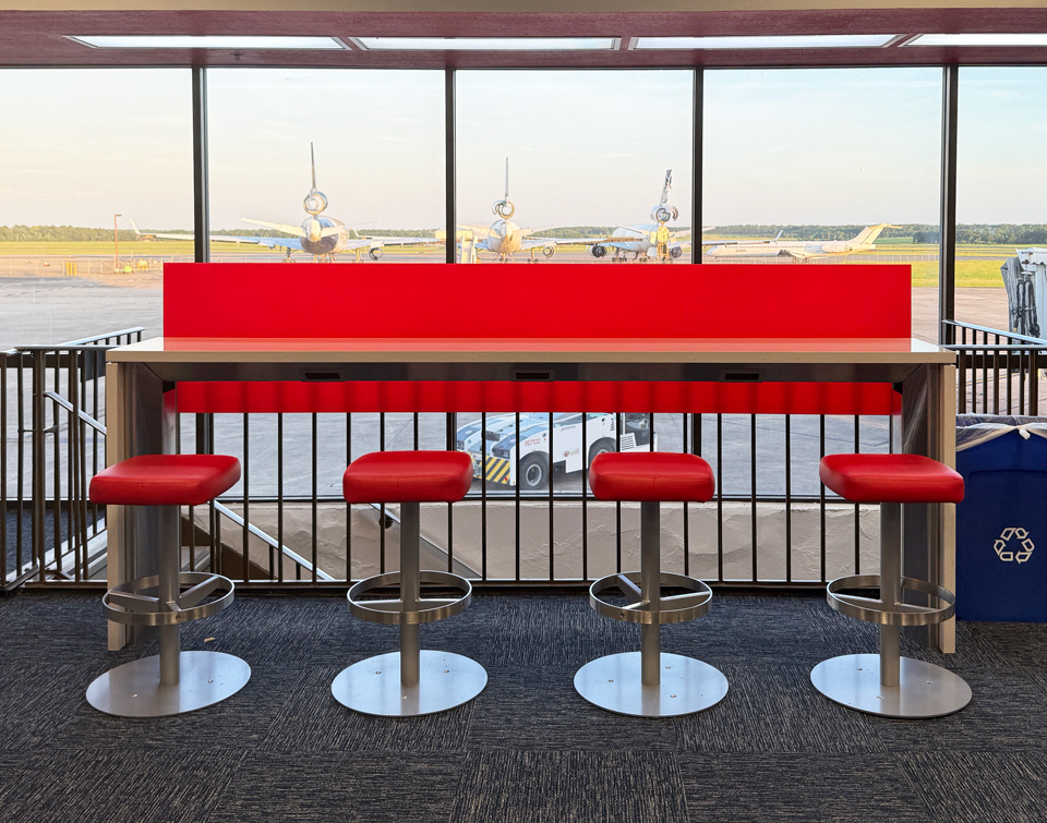 Skinny Bar with Altezza Stool offers charging workspace at Shreveport Airport, giving passengers a great experience