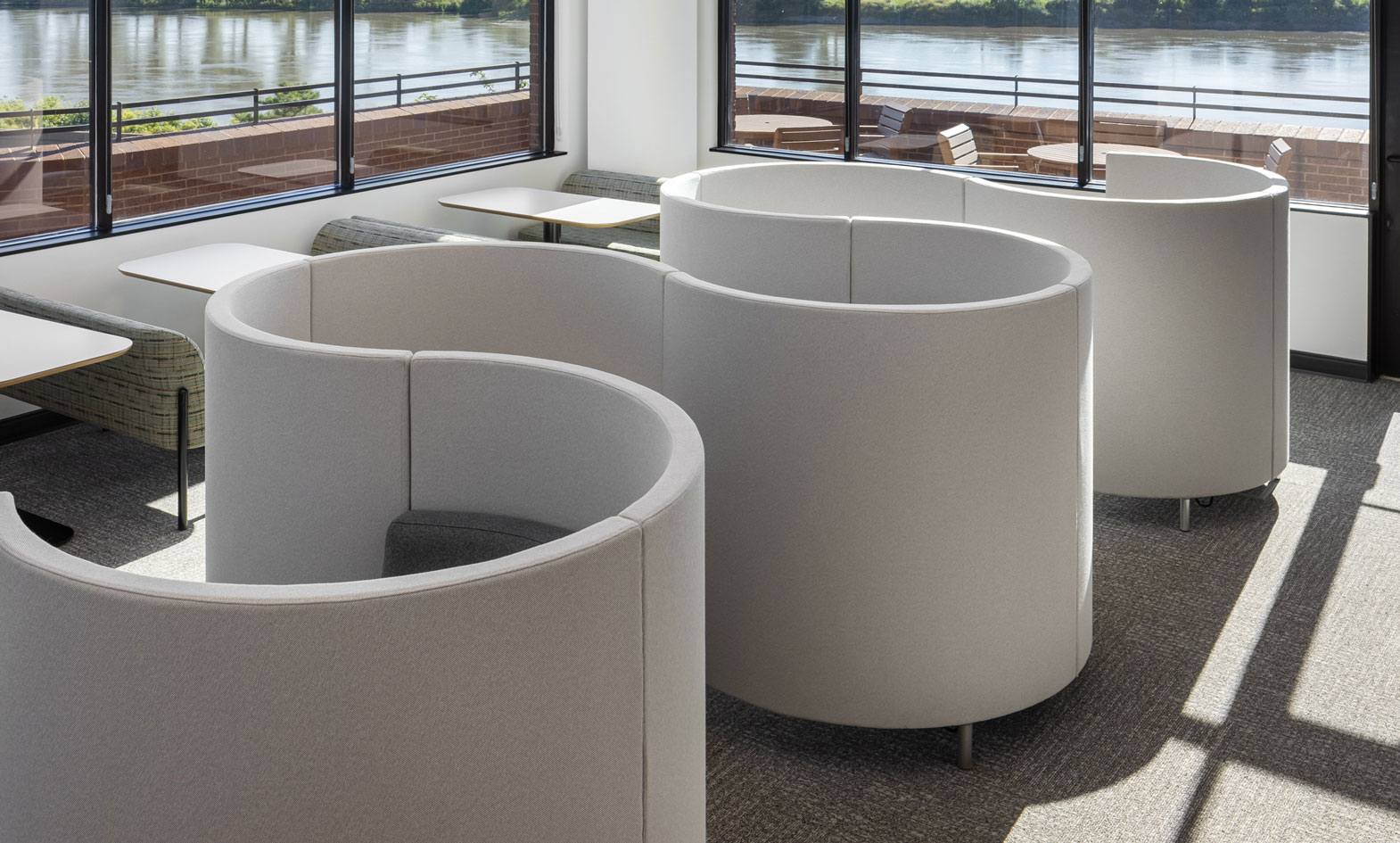 Work pods with attached seat in corporate office