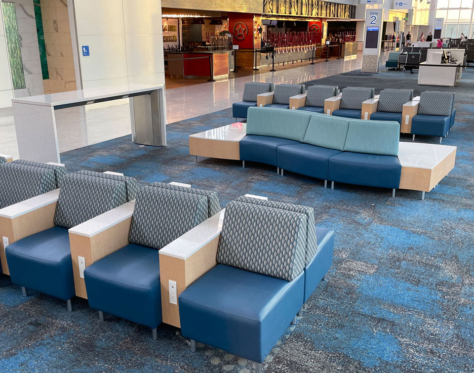 Airport Furniture featuring power bar, and Agati lounge seating with side tables