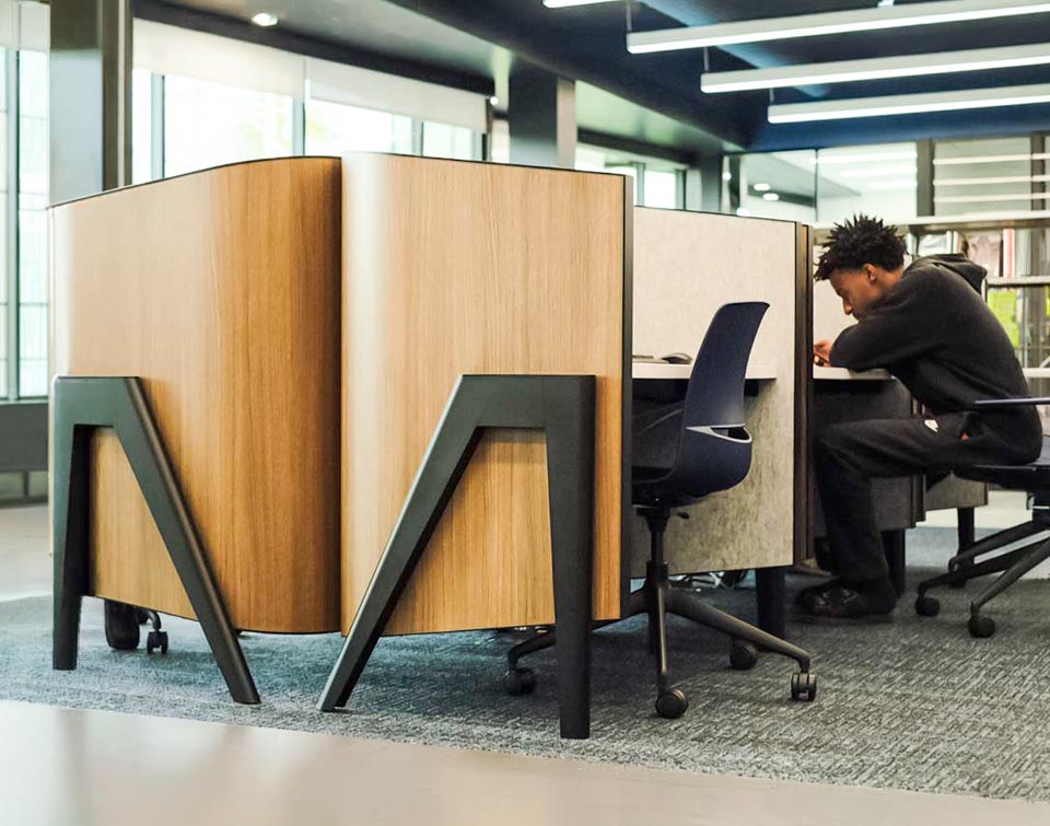 Patrons at the columbus metropolitan library using the cove study carrel