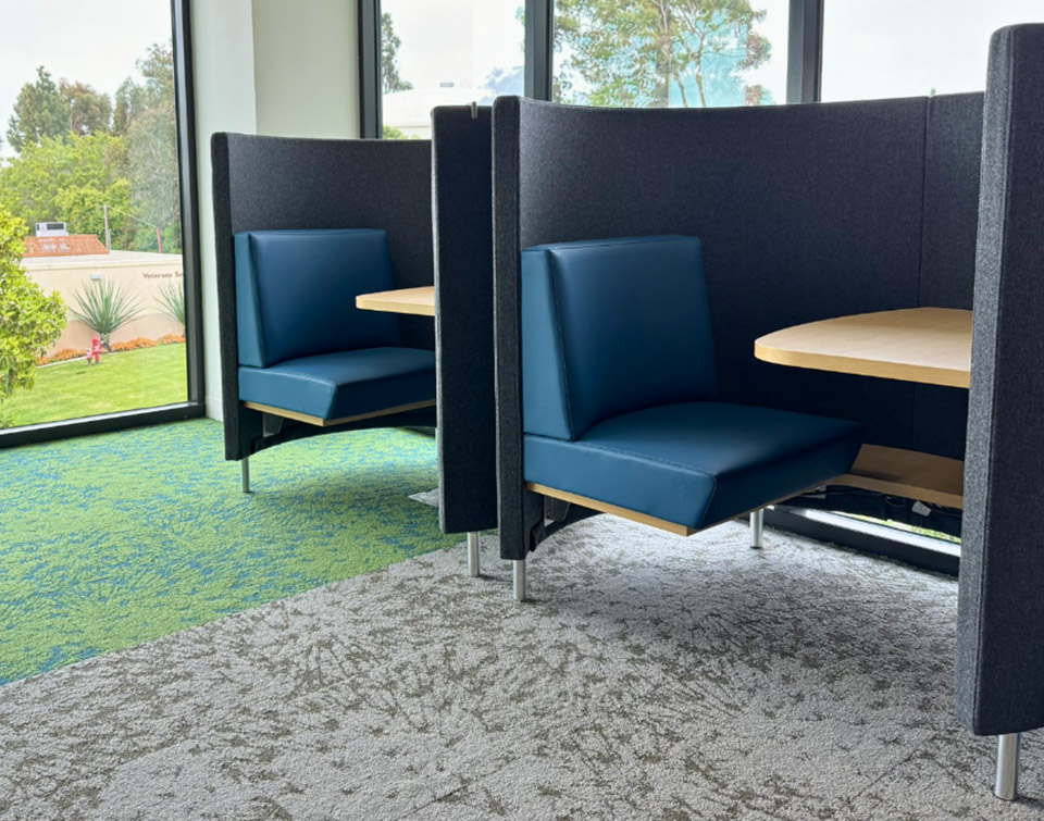 Two Agati POD study carrels in a row beside a window at MiraCosta College's San Elijo campus library