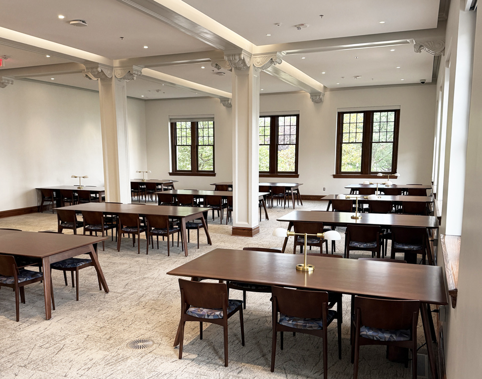 Dark-wood AGATI Etta study tables beneath historic column capitals in JMU Carrier Library’s restored wing.