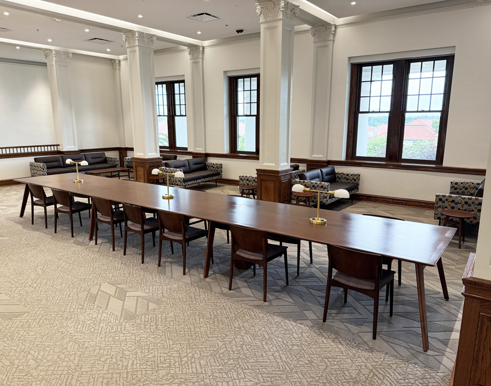 Long custom AGATI Etta group study table with reading lamps and power outlets at JMU Carrier Library.